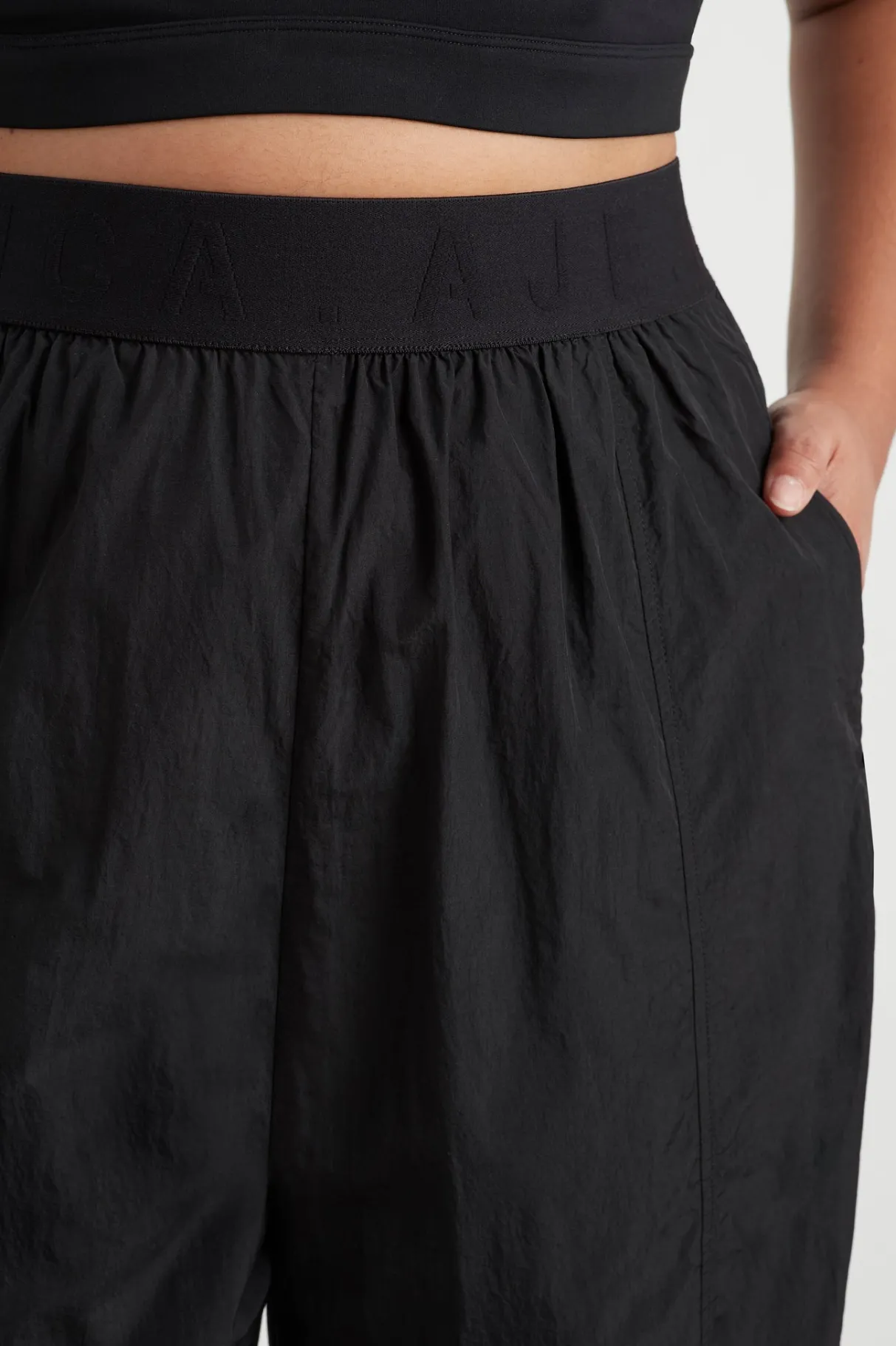 logotape_spray_trackpants__13.webp Fashion Aje ATHLETICA Logotape Spray Trackpants 511 Black