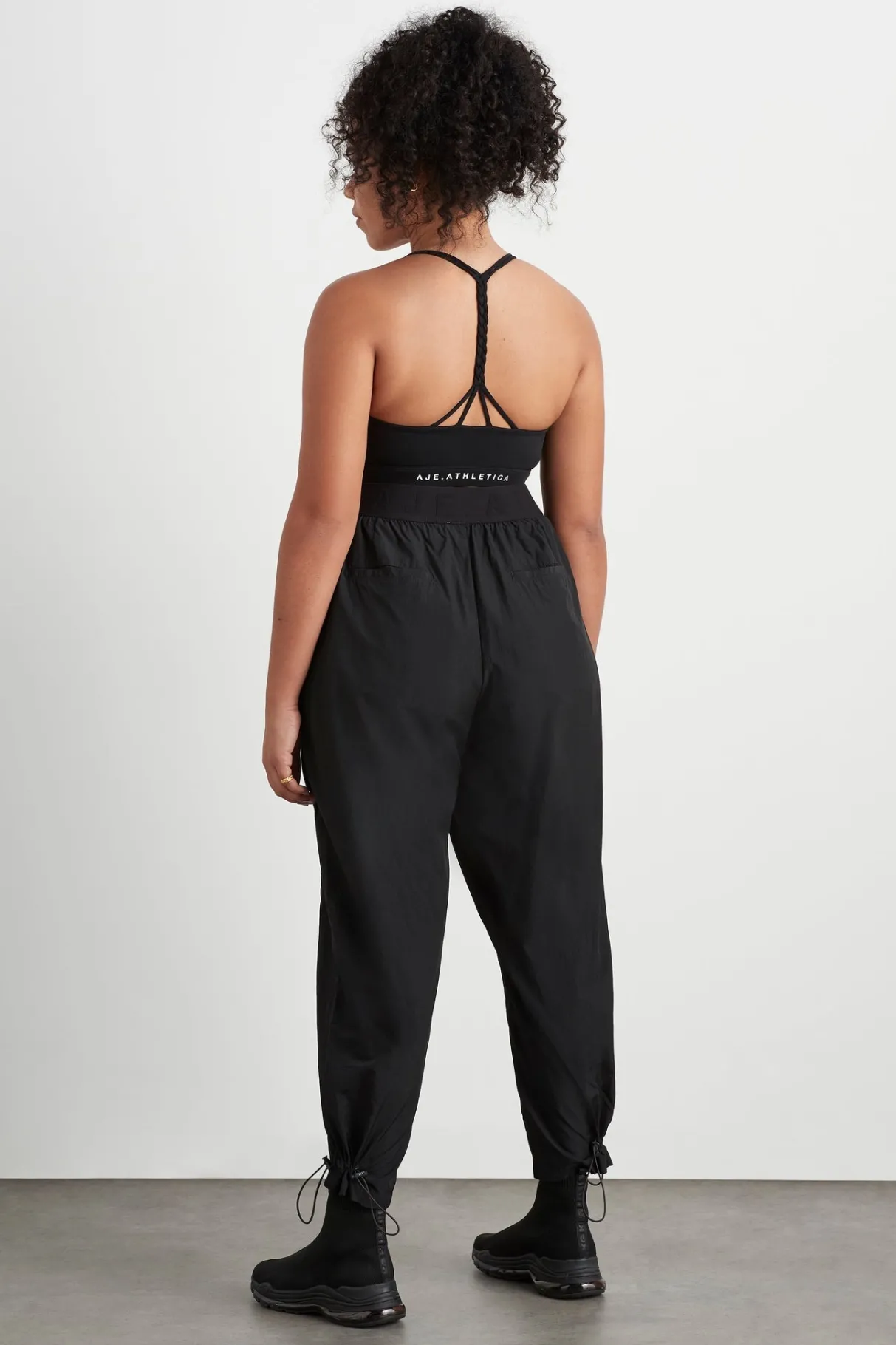 logotape_spray_trackpants__14.webp Fashion Aje ATHLETICA Logotape Spray Trackpants 511 Black
