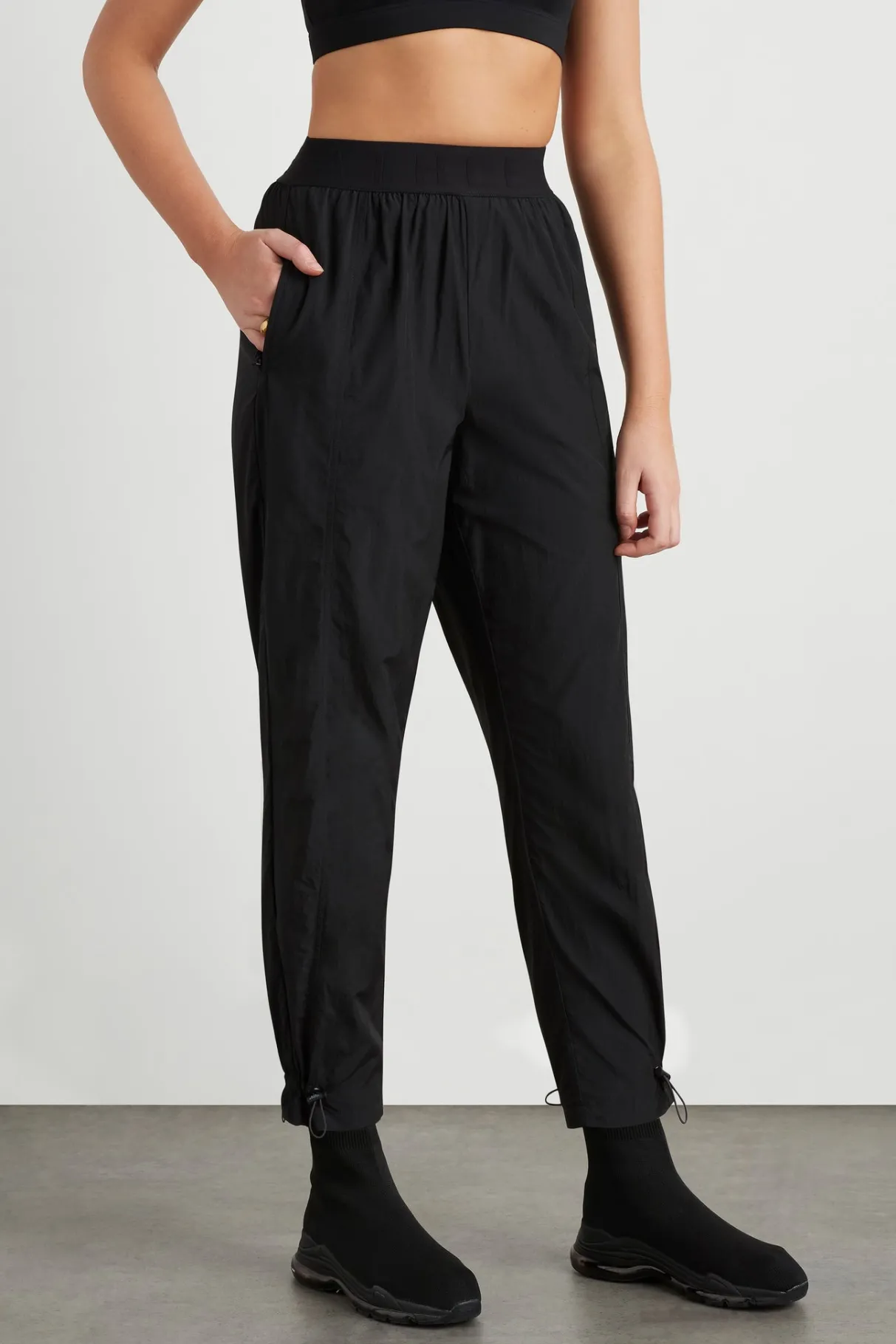 logotape_spray_trackpants__2.webp Fashion Aje ATHLETICA Logotape Spray Trackpants 511 Black