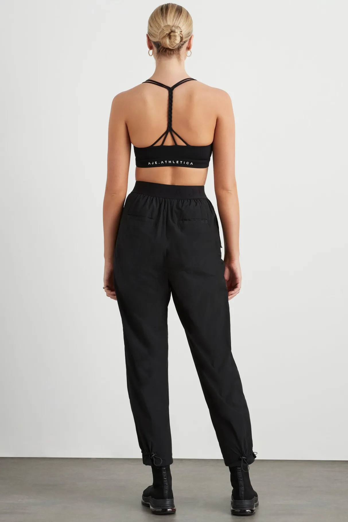 logotape_spray_trackpants__4.webp Fashion Aje ATHLETICA Logotape Spray Trackpants 511 Black