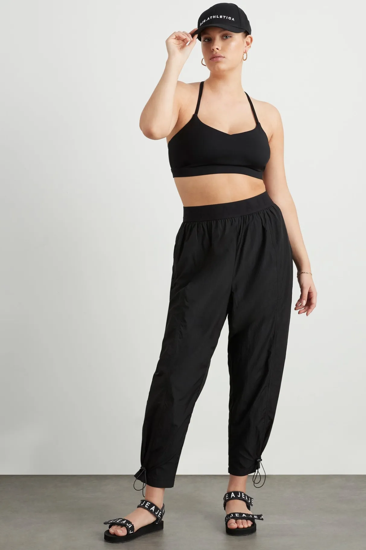 logotape_spray_trackpants__6.webp Fashion Aje ATHLETICA Logotape Spray Trackpants 511 Black