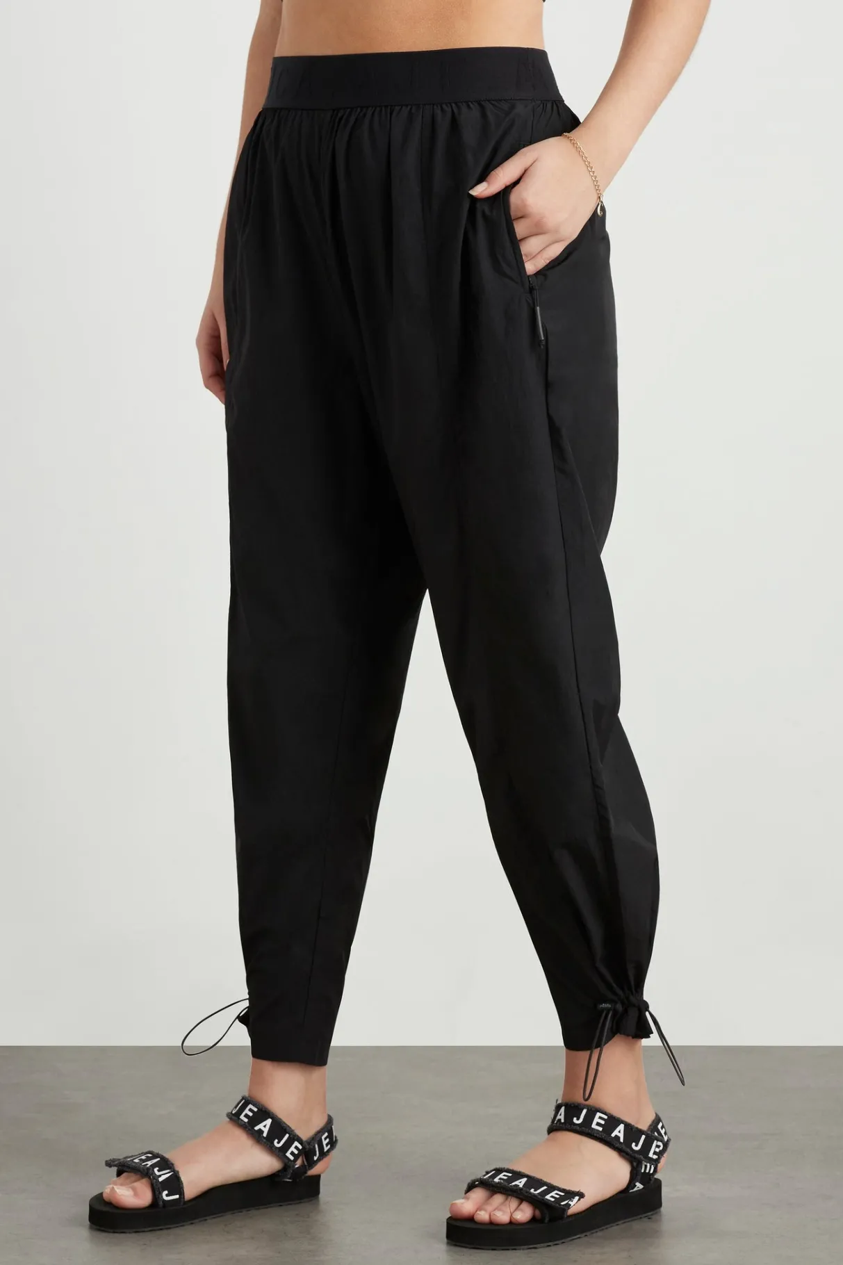 logotape_spray_trackpants__7.webp Fashion Aje ATHLETICA Logotape Spray Trackpants 511 Black