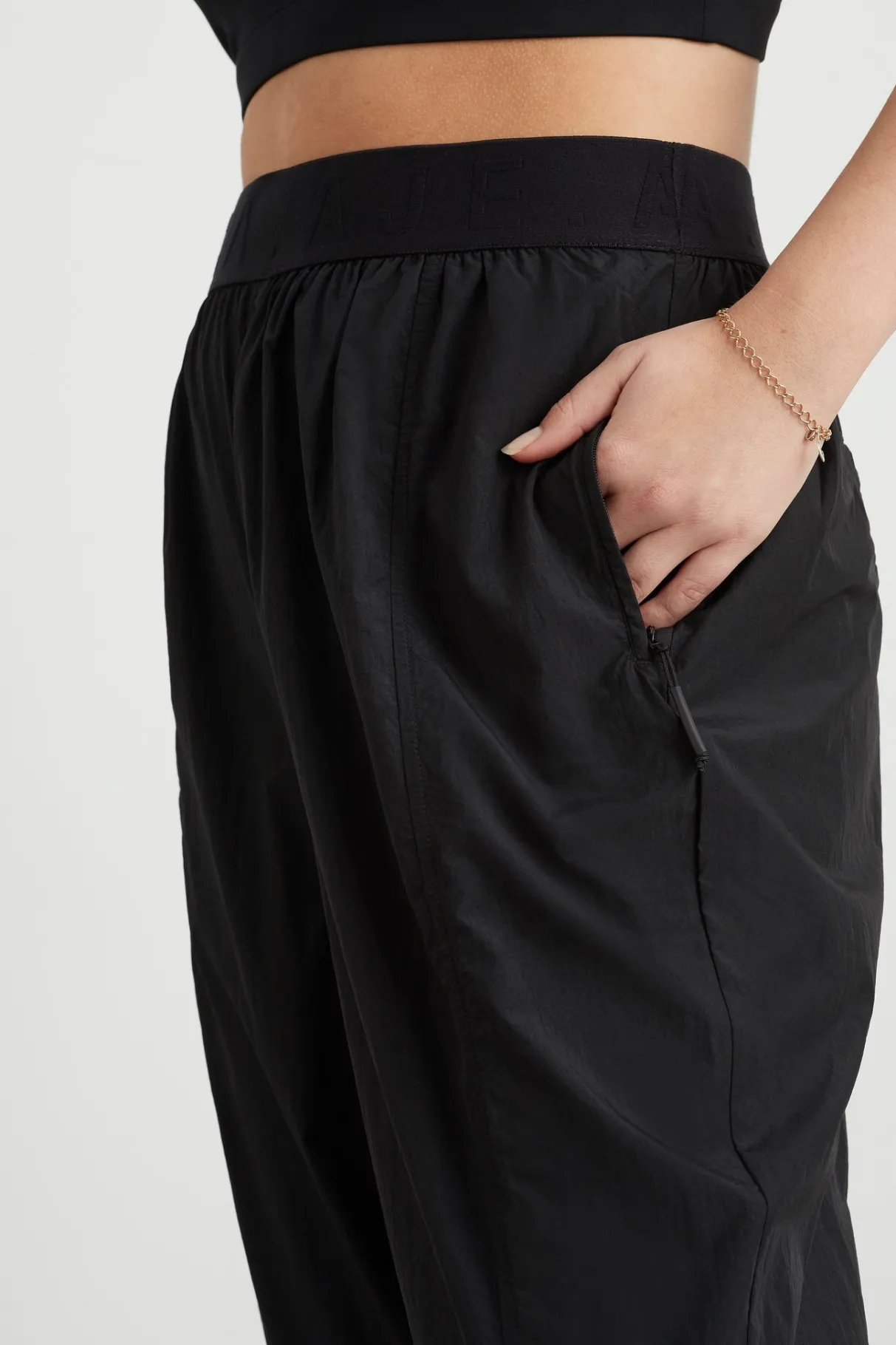 logotape_spray_trackpants__8.webp Fashion Aje ATHLETICA Logotape Spray Trackpants 511 Black