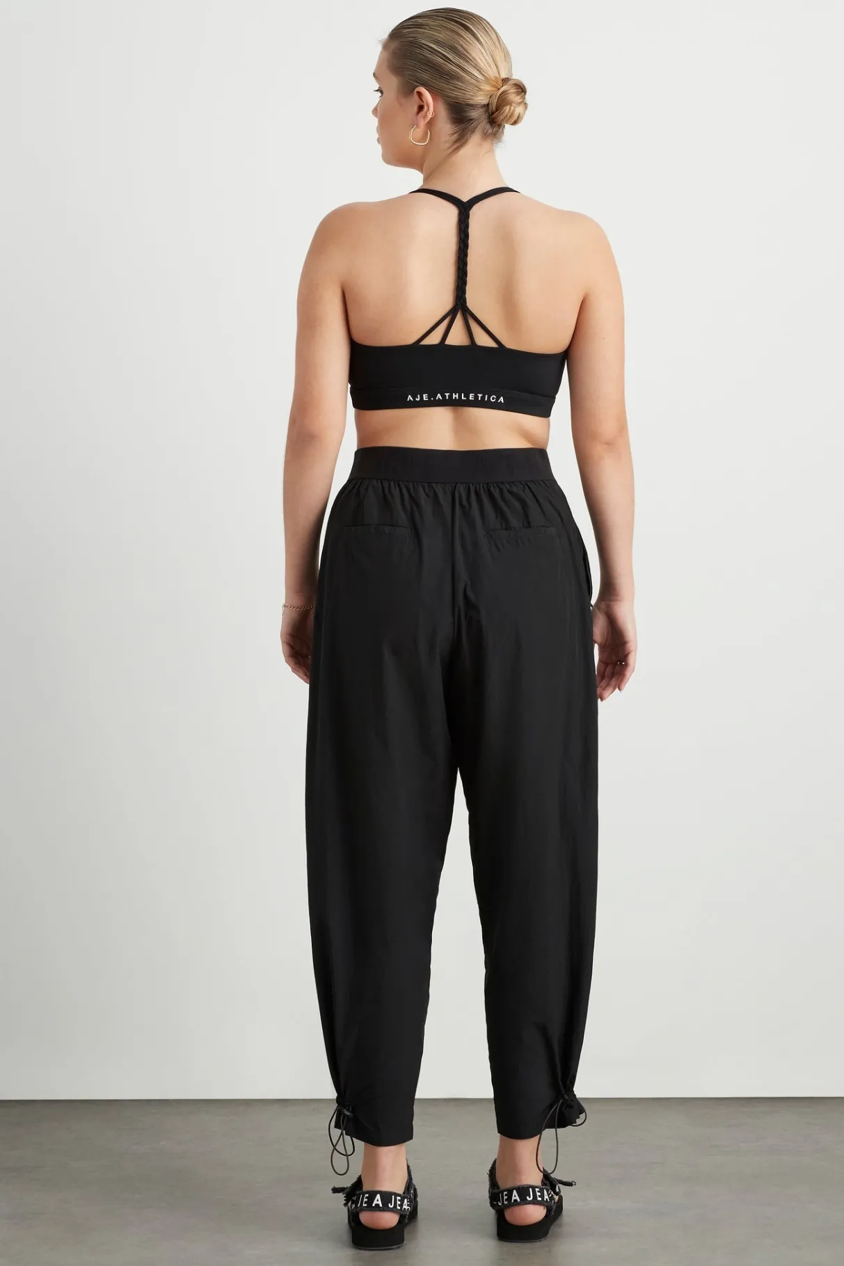 logotape_spray_trackpants__9.webp Fashion Aje ATHLETICA Logotape Spray Trackpants 511 Black