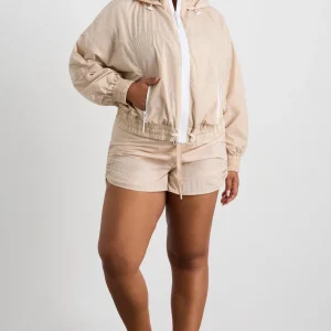 Shop Aje ATHLETICA Long Line Spray Jacket Latte Beige