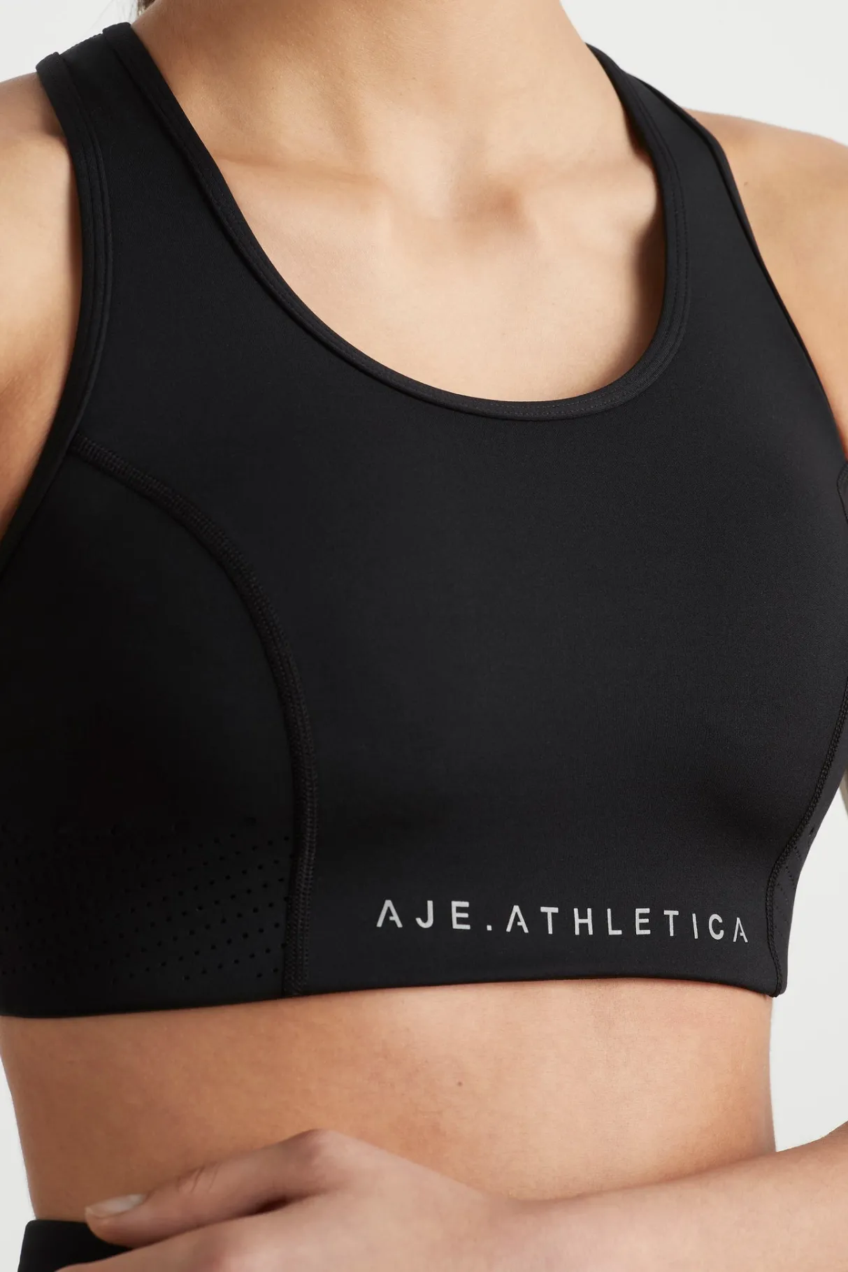 perforated_racer_sports_bra__3-1.webp Flash Sale Aje ATHLETICA Perforated Racer Sports Bra 339 Black/Reflective