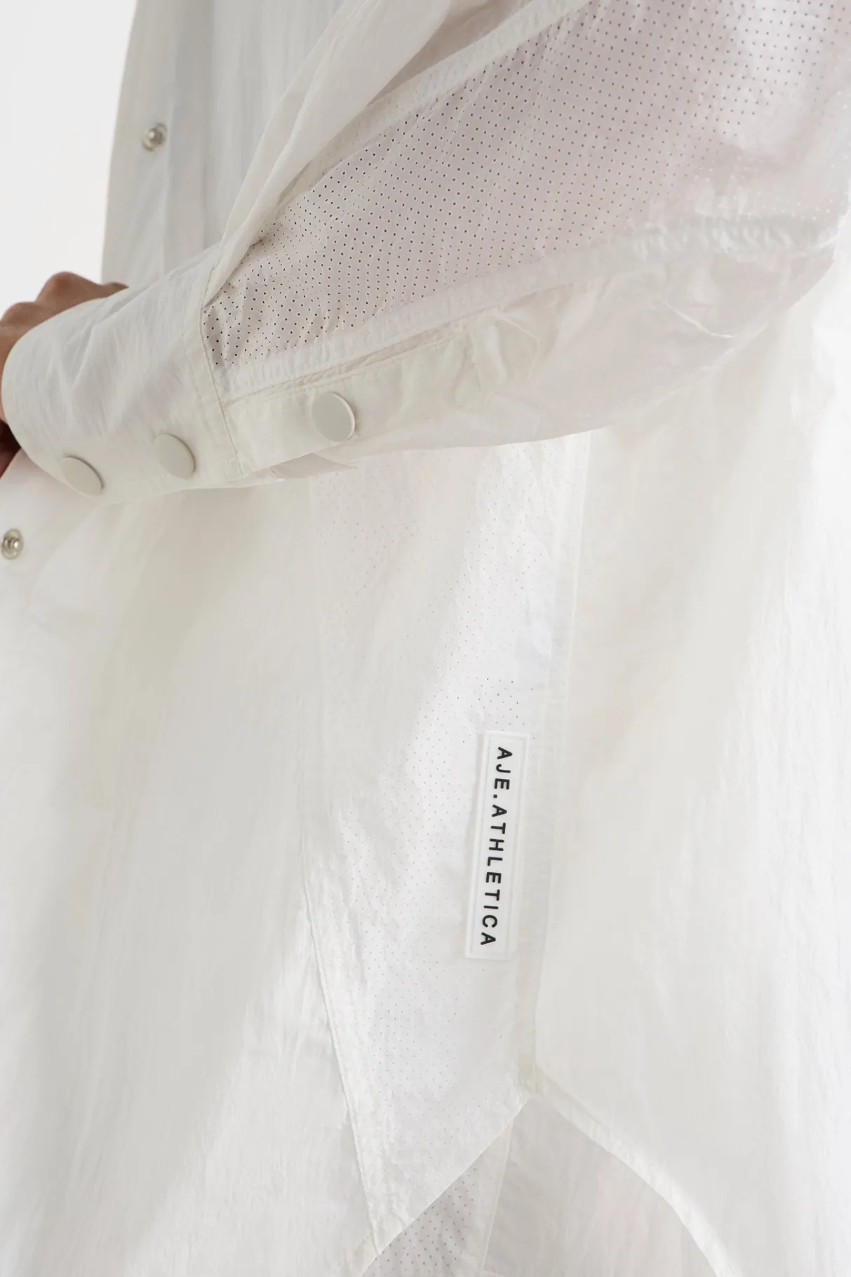 perforated_spray_shirt__3-1.webp Flash Sale Aje ATHLETICA Perforated Spray Shirt 406 White