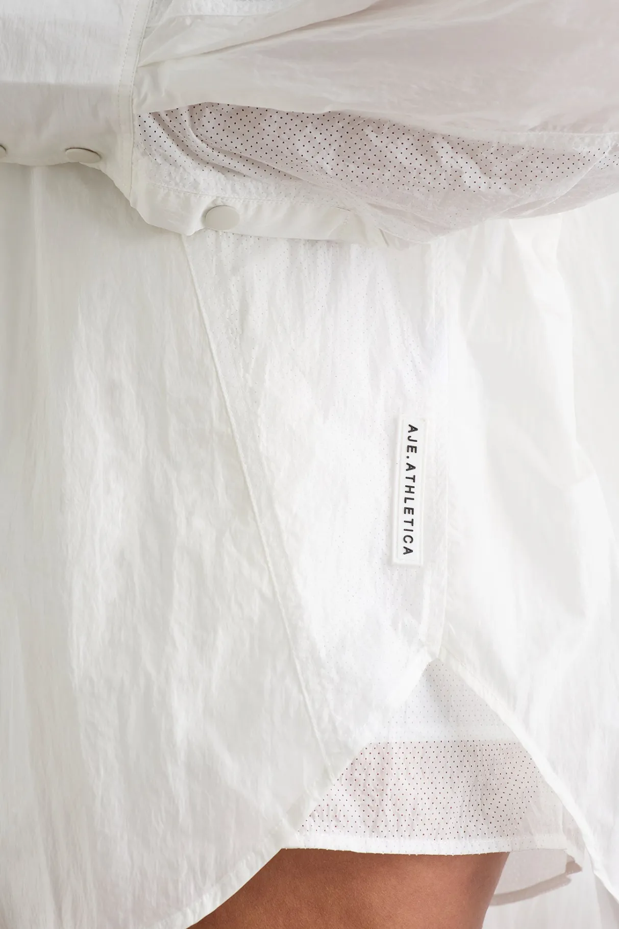 perforated_spray_shirt__8-1.webp Flash Sale Aje ATHLETICA Perforated Spray Shirt 406 White