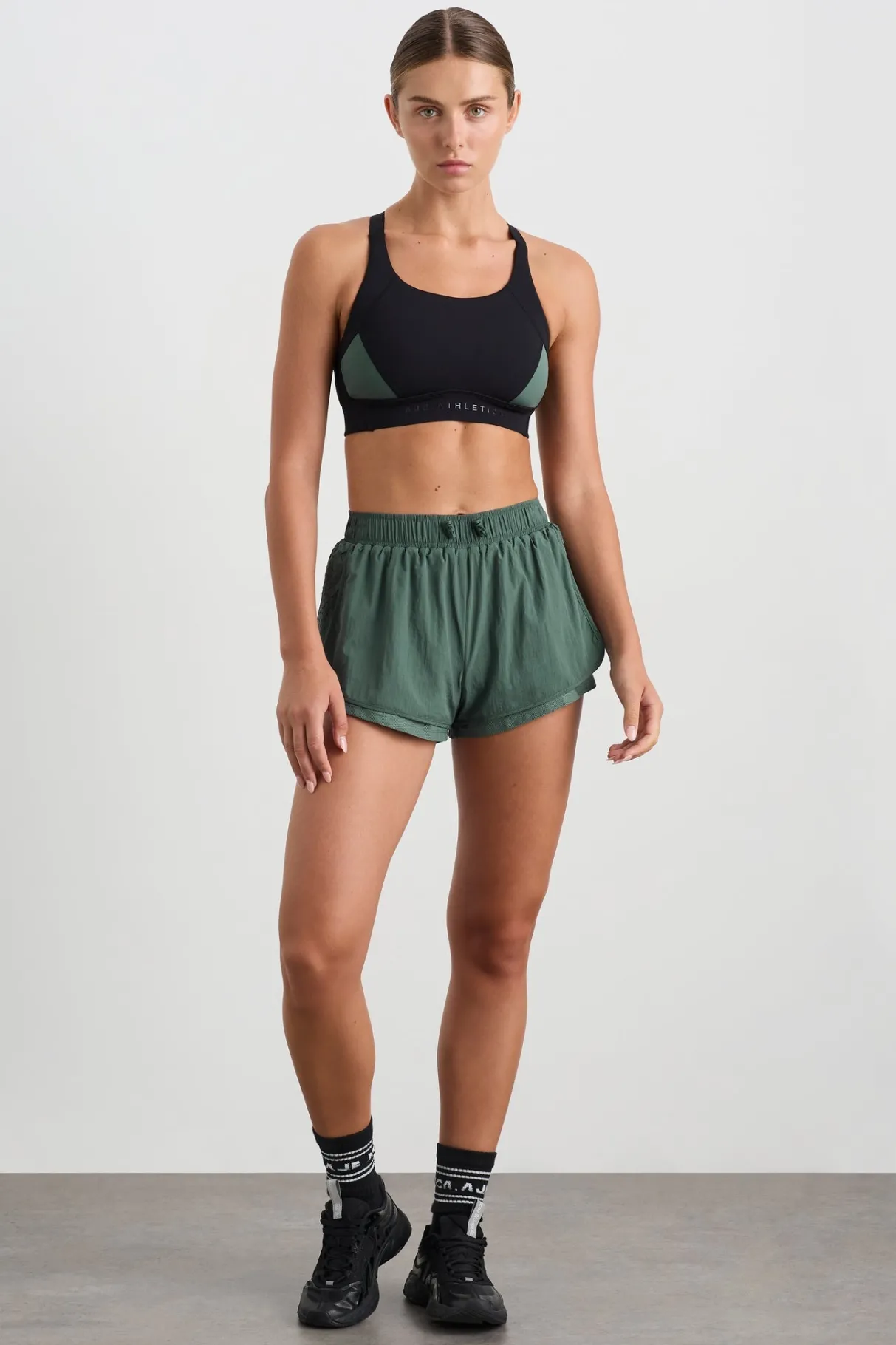 perforated_spray_shorts__0.webp Shop Aje ATHLETICA Perforated Spray Shorts 019 Moss Green