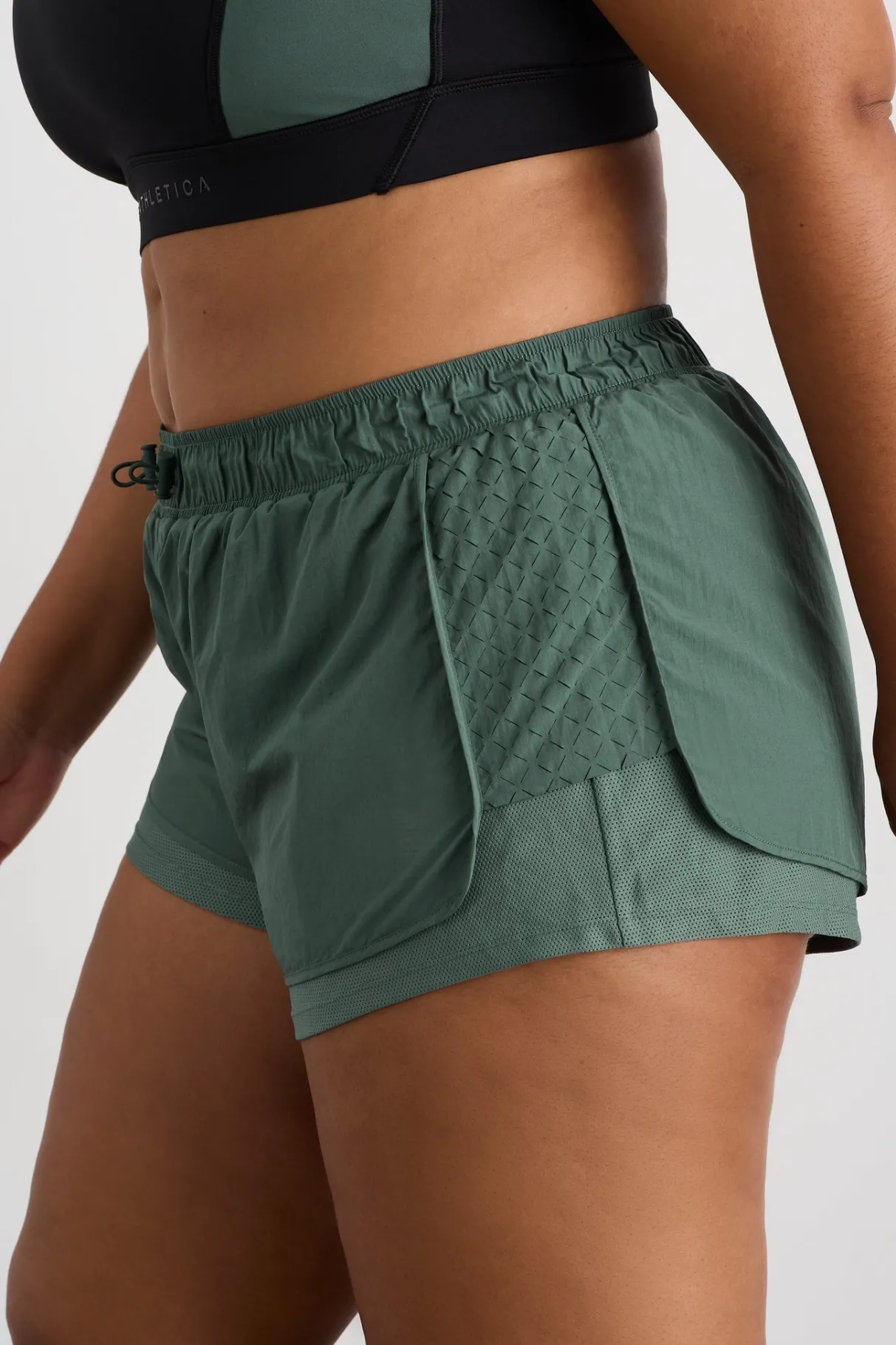 perforated_spray_shorts__14.webp Shop Aje ATHLETICA Perforated Spray Shorts 019 Moss Green