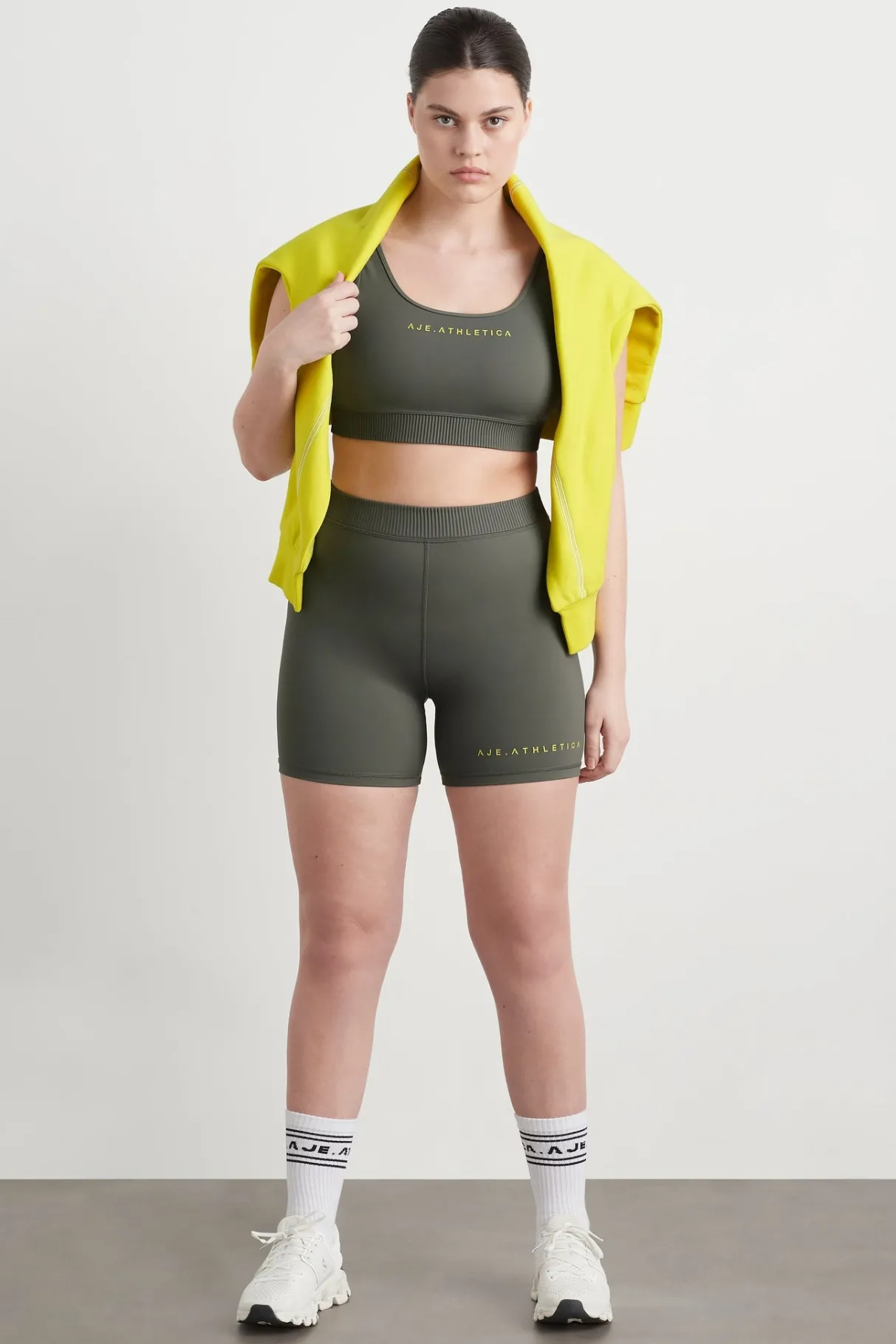 pintuck_effect_sports_bra__10.webp Clearance Aje ATHLETICA Pintuck Effect Sports Bra 327 Midnight Grey/Citrus Yellow