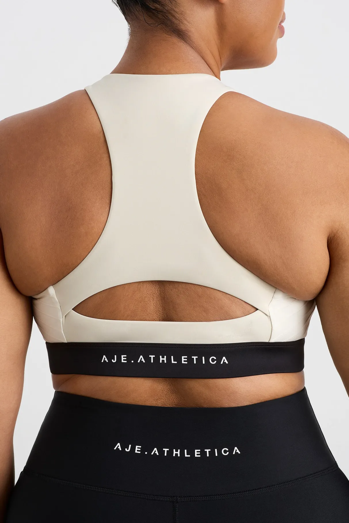 quilted_zip_front_bra__12.webp New Aje ATHLETICA Quilted Zip Front Bra 304 Moonstone Grey / Ecru / Black