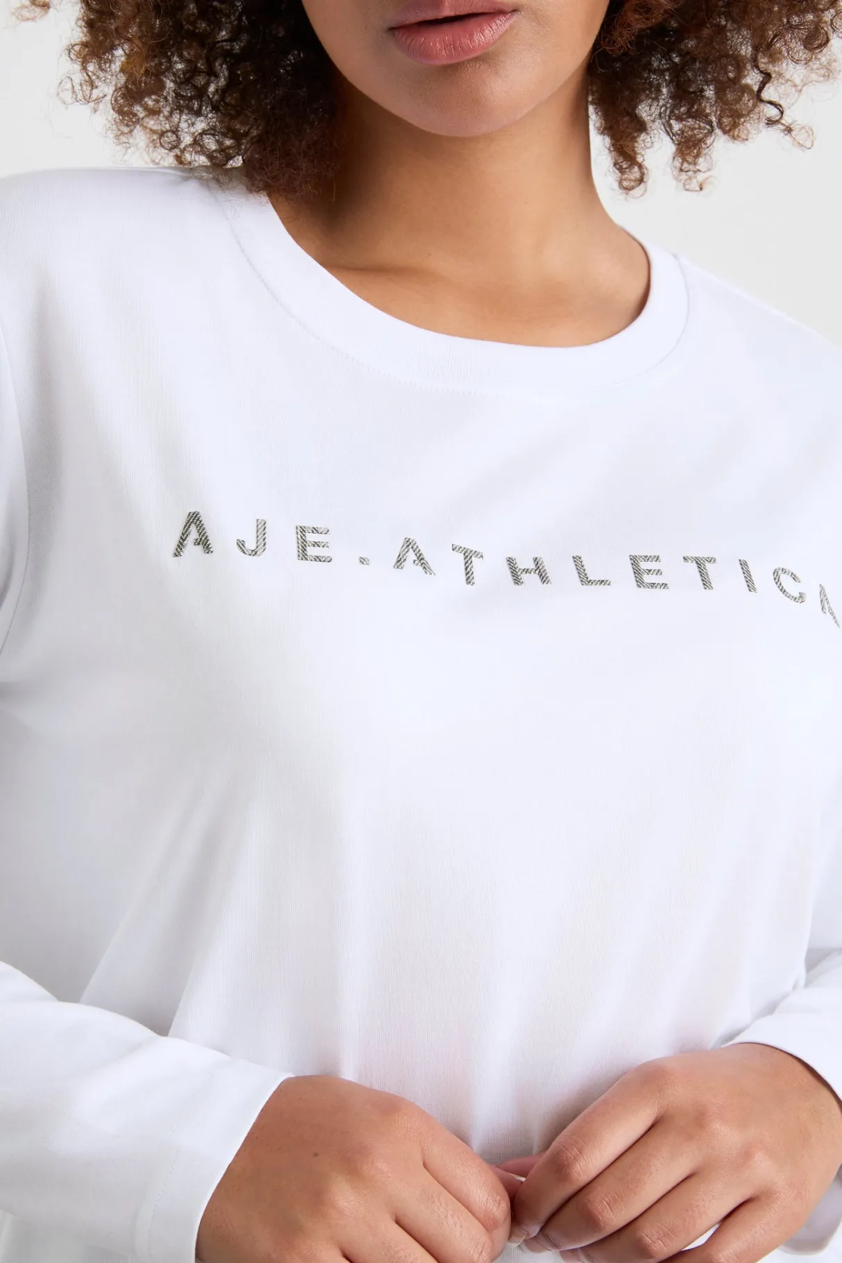 signature_logo_long_sleeve_tshirt__11.webp Shop Aje ATHLETICA Signature Logo Long Sleeve T-Shirt 127 White/Herringbone