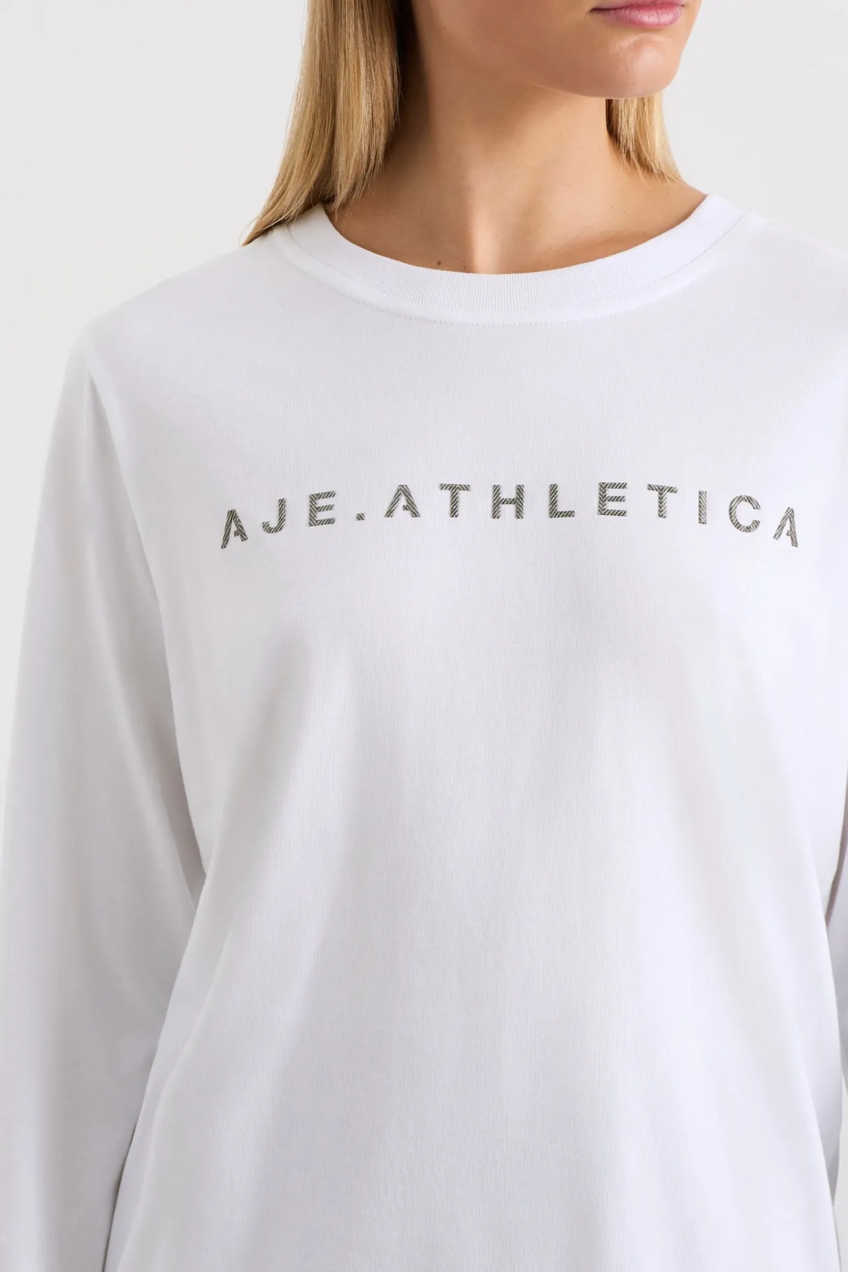 signature_logo_long_sleeve_tshirt__3.webp Shop Aje ATHLETICA Signature Logo Long Sleeve T-Shirt 127 White/Herringbone