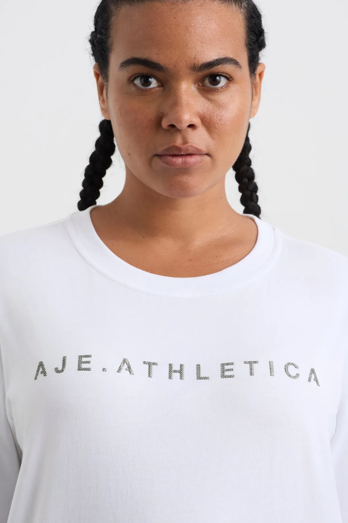 signature_logo_long_sleeve_tshirt__7.webp Shop Aje ATHLETICA Signature Logo Long Sleeve T-Shirt 127 White/Herringbone