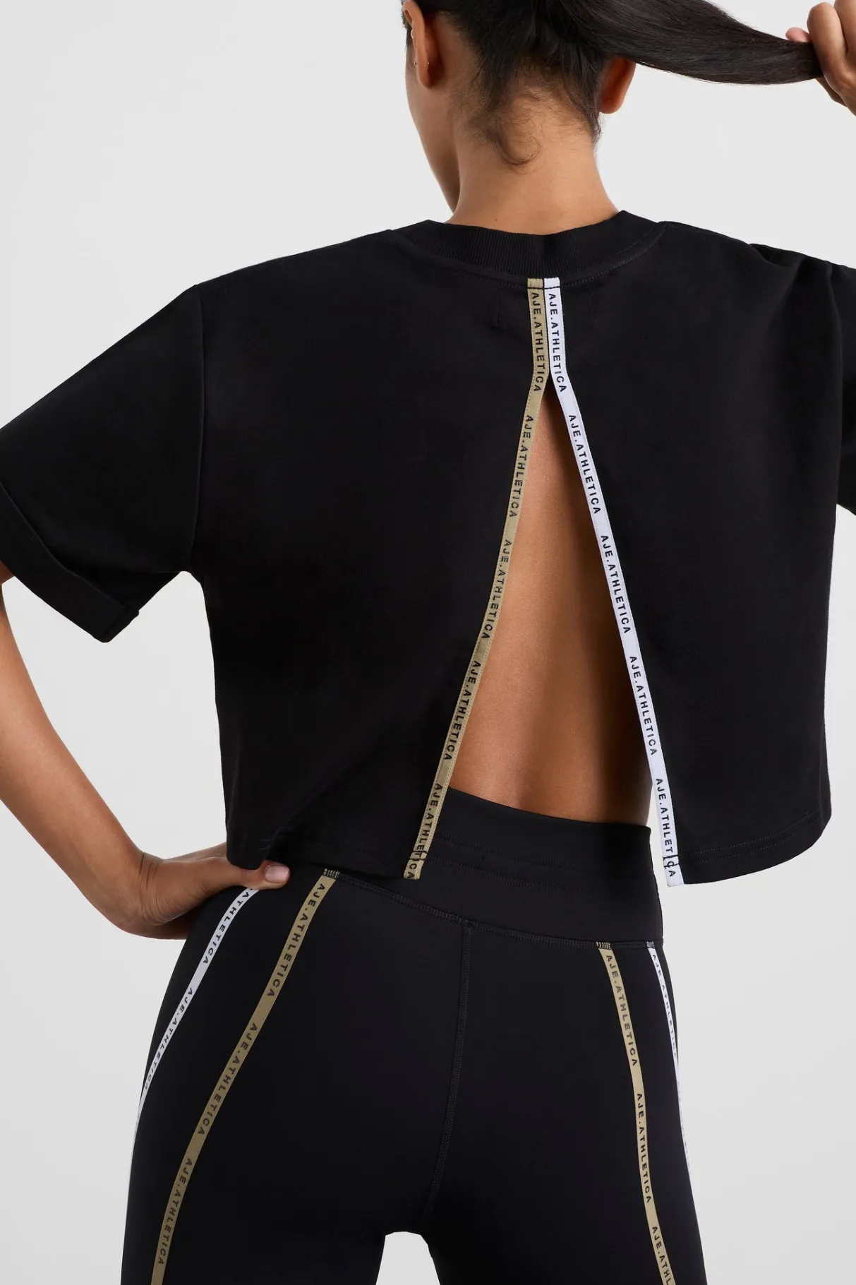 split_back_crop_tee__0.webp Online Aje ATHLETICA Split Back Crop Tee 114 Black/Multi