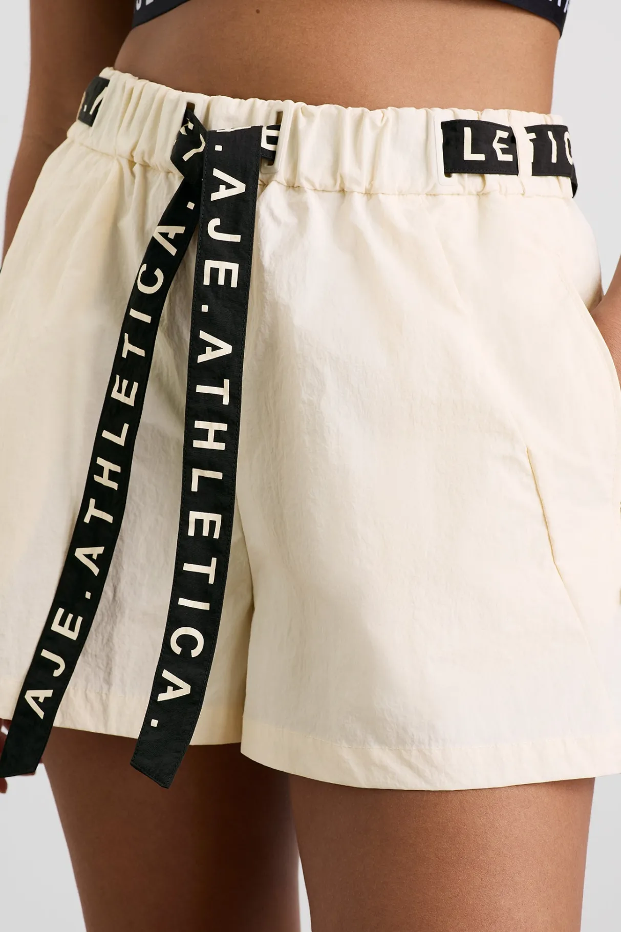 spray_shorts__8-2.webp New Aje ATHLETICA Spray Shorts 608 Limestone Beige Black