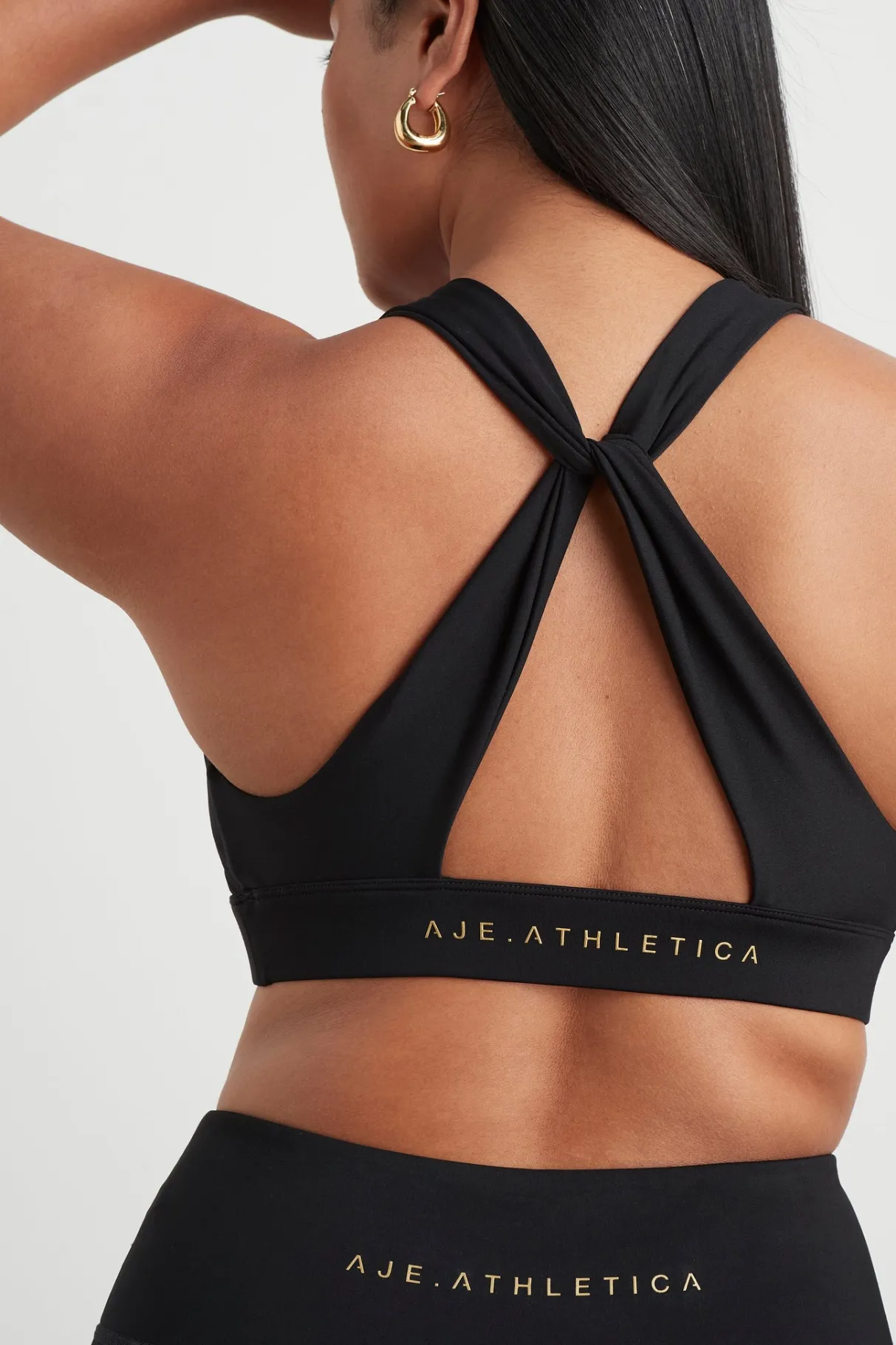 twist_back_sports_bra__7-1.webp Fashion Aje ATHLETICA Twist Back Sports Bra 335 Black/Gold