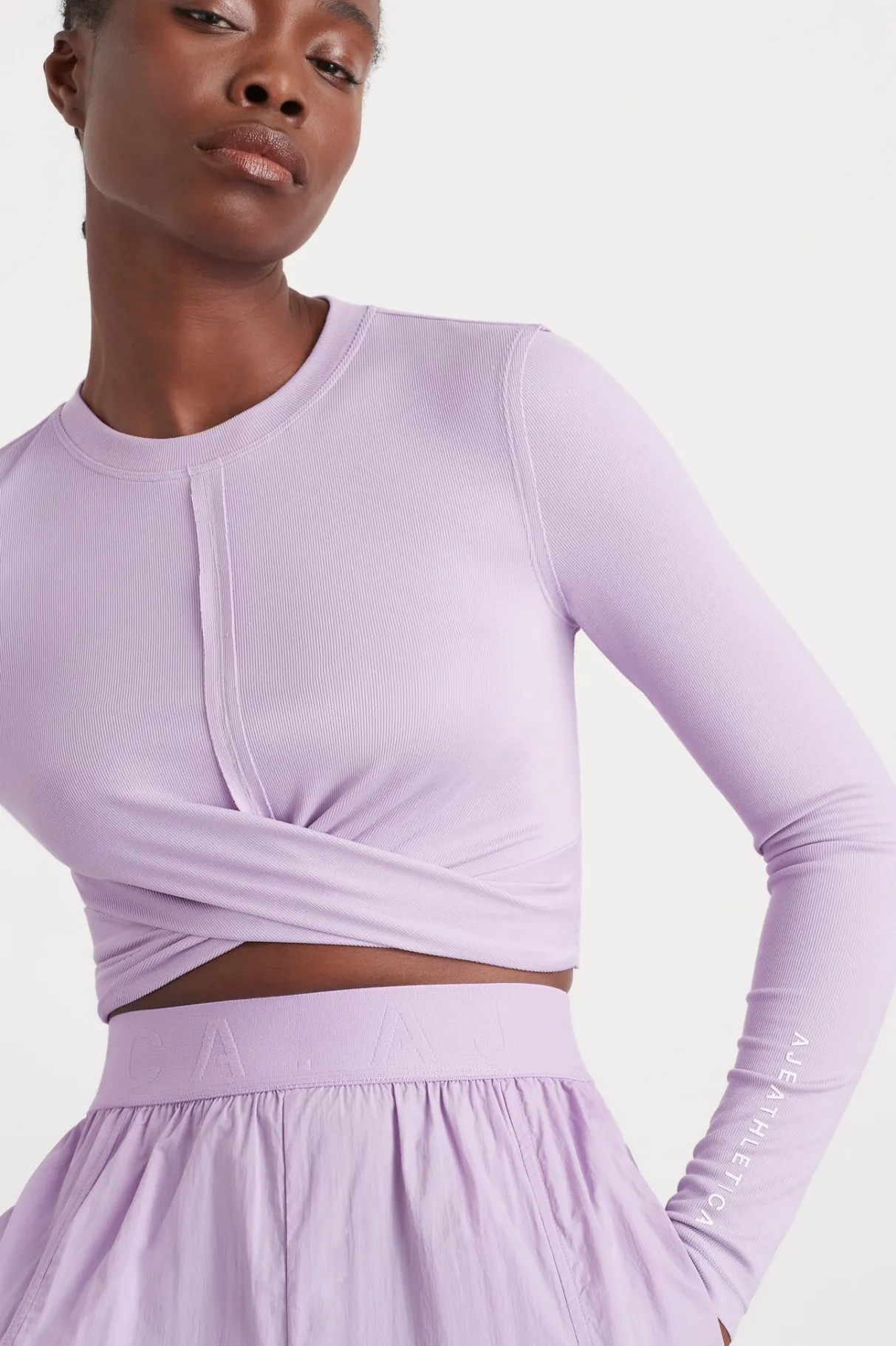 twist_front_long_sleeve_crop_top__0-1.webp Fashion Aje ATHLETICA Twist Front Long Sleeve Crop Top 328 Lavender/White