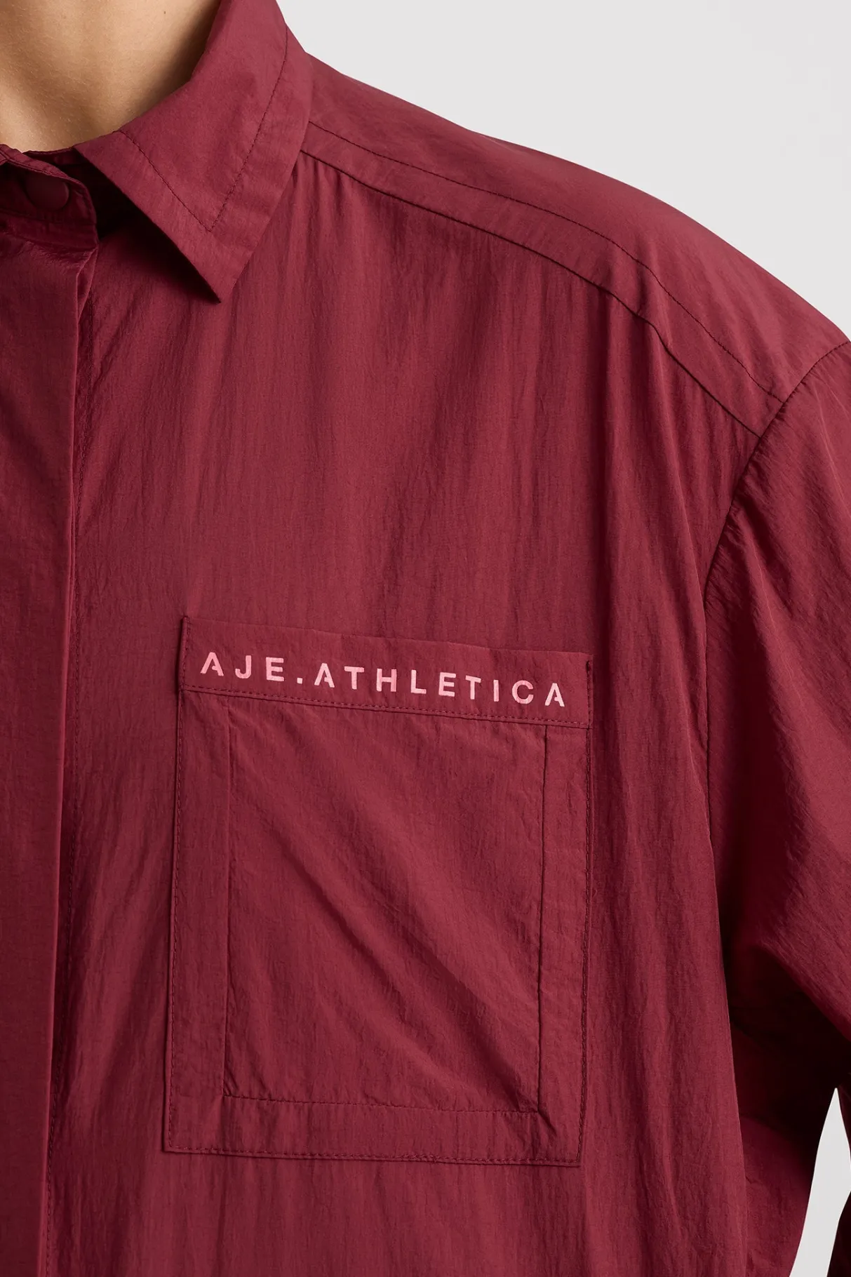 windbreaker_shirt__3-4.webp Hot Aje ATHLETICA Windbreaker Shirt 406 Plum Red