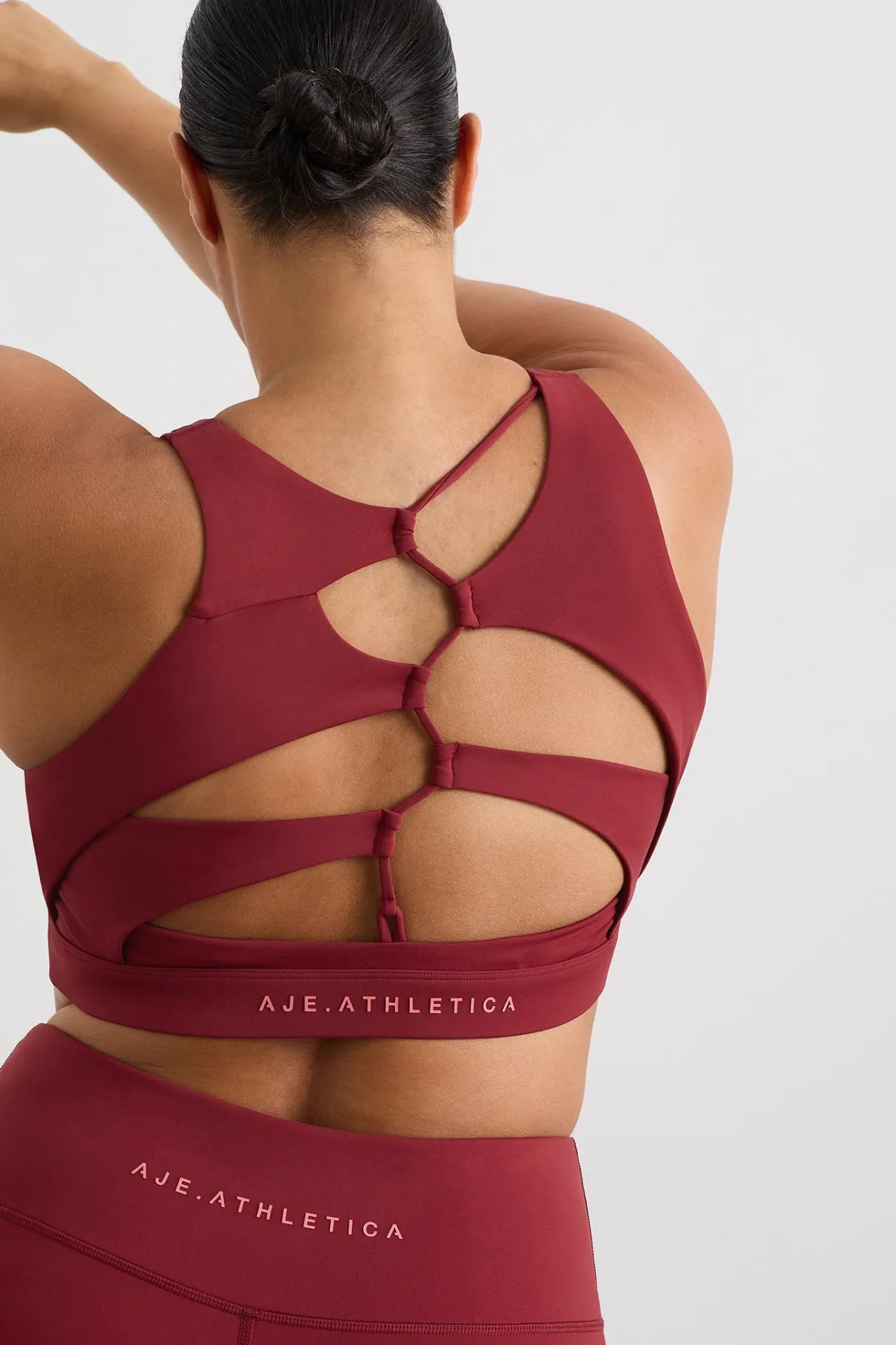 winding_road_high_neck_bra__11-1.webp Discount Aje ATHLETICA Winding Road High Neck Bra 364 Plum Red