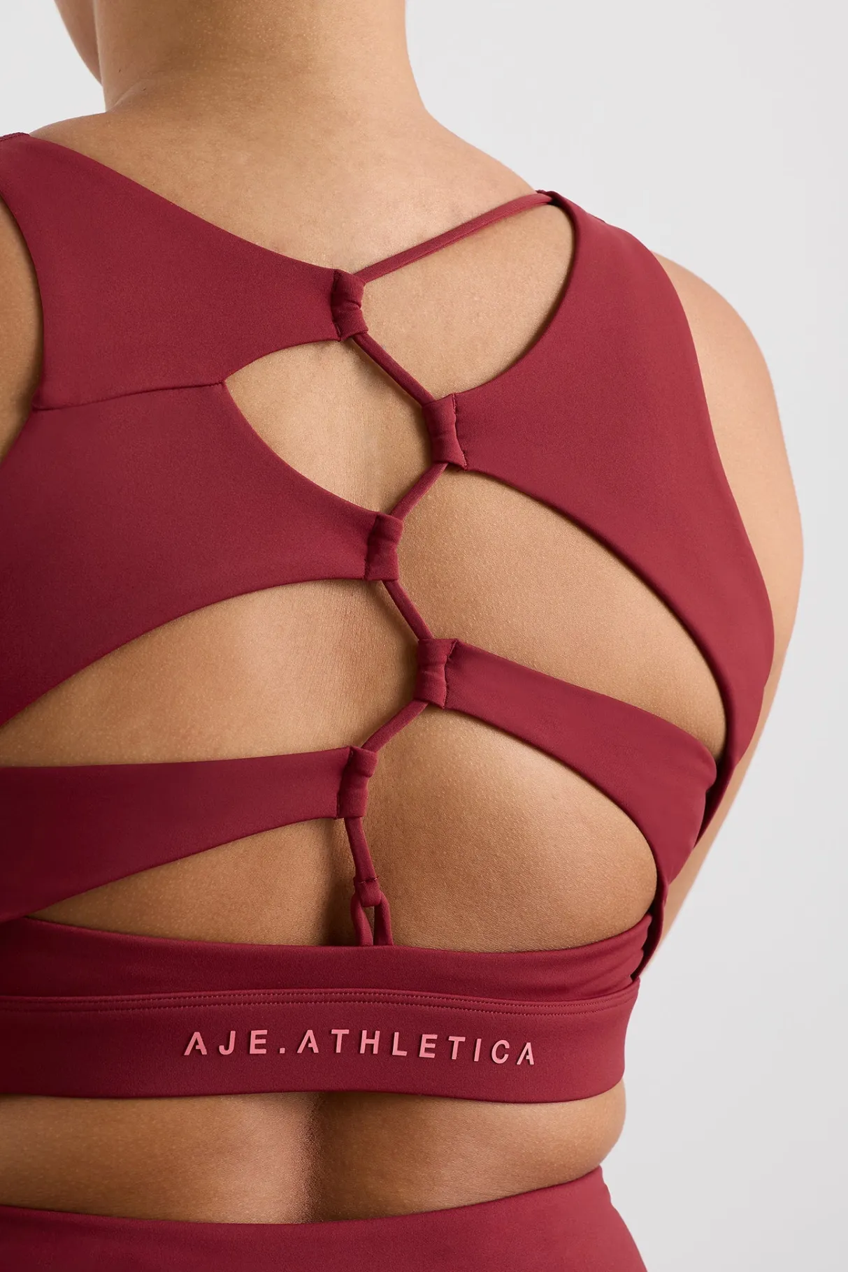 winding_road_high_neck_bra__14-1.webp Discount Aje ATHLETICA Winding Road High Neck Bra 364 Plum Red