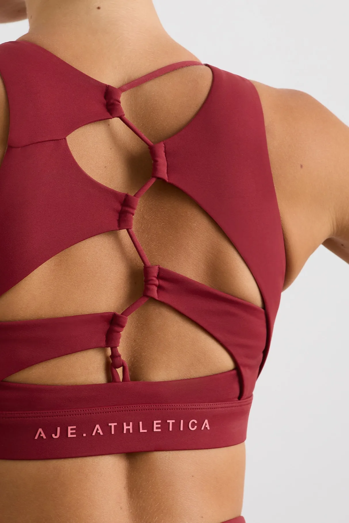 winding_road_high_neck_bra__4-1.webp Discount Aje ATHLETICA Winding Road High Neck Bra 364 Plum Red