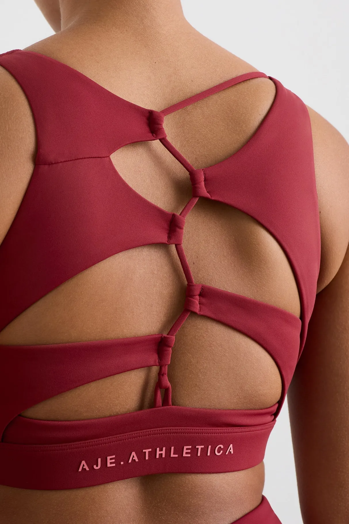 winding_road_high_neck_bra__9-1.webp Discount Aje ATHLETICA Winding Road High Neck Bra 364 Plum Red